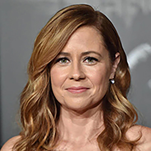 Jenna Fischer wearing a navy blue dress while attending a movie premier