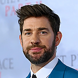 John Krasinski wearing a bright blue suit attending a premier